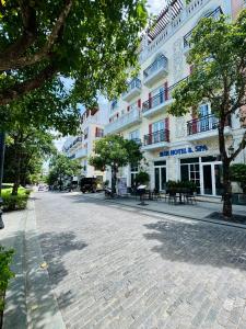 a cobblestone street in front of a building at Blue Hotel Sunset Town Phu Quoc in Phú Quốc