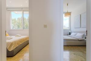 a bedroom with a bed and a window at Olymp Luxury Residence in Kissonerga +33 photos