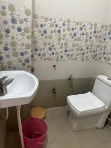 a bathroom with a sink and a toilet at KK Hotel in Jaipur +28 photos