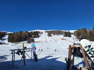 a group of people skiing down a snow covered slope at Casa Safra in Kötschach