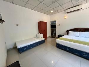 a room with two beds in a room at The Rock Yala in Yala