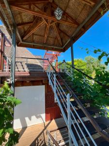 a staircase leading up to a building with a roof at Casa cu Stuf Olimp in Olimp