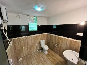 a bathroom with a toilet and a sink at The Rock Yala in Yala +24 photos