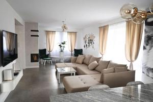 a living room with a couch and a table at U Edzia in Kochoń