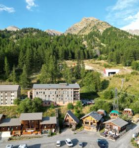 an aerial view of a resort with a mountain at Chalet Pointu in Isola 2000