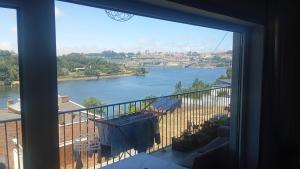 a view of a river from a window at Telhadosolitario in São Pedro da Cova