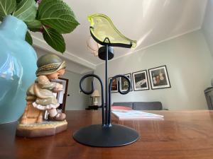 a lamp on a table with a figurine on it at L'ora del tè in Cremona