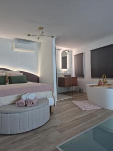 a bedroom with a bed and a tub and a sink at Maison H - Logement de luxe avec jacuzzi privé et home cinéma immersif in Herstal
