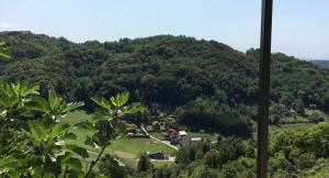 a view of a mountain with a village in the foreground at Chalet Le Klet in Krapinske Toplice +7 photos