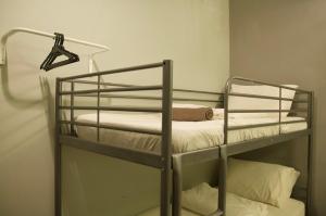 a bunk bed room with two bunk beds at GRAYHAUS SOHO Ipoh in Ipoh