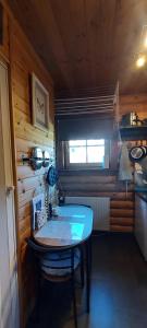 a small room with a table in a cabin at Solar eclipse Iceland Small studio in Kjalarnes in Reykjavík