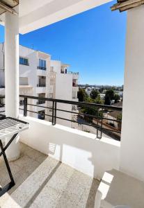 a balcony with a view of a building at Superb apartment Monastir in Monastir