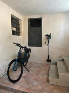 a bike parked in a room with a wall at Nella Corte - La Casetta in Corte Franca