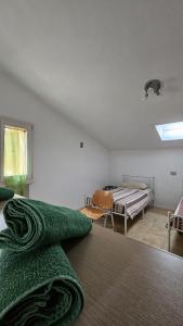 a bedroom with a bed and a room with a window at Nonna Marisa B&B in Madonna di Fornelli