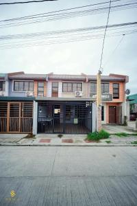 a building on the corner of a street at Sam's Residence in Marilao