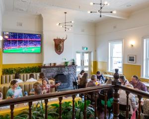 a group of children sitting in a room with a fireplace at The Beaconsfield Hotel in Fremantle +17 photos