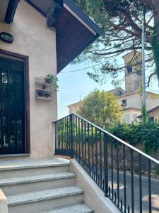 a set of stairs leading to a door of a house at Nella Corte - La Casetta in Corte Franca