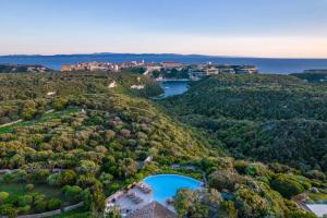 an aerial view of a house on a hill at Hôtel Cala di Greco in Bonifacio