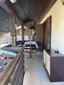 a room with a table and a bench and a table sidx sidx at The Yugo House in Bohinj