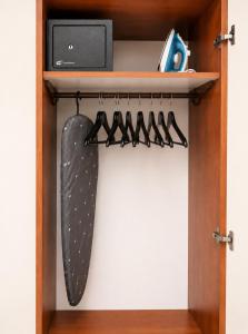 a skateboard is hanging on a shelf in a closet at Gallery in Ammouliani