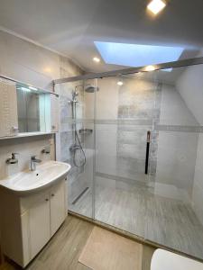 a bathroom with a shower and a sink at Balchik English House in Balchik