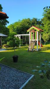 a playground in a park with a play structure at Casa Maria in Avrig