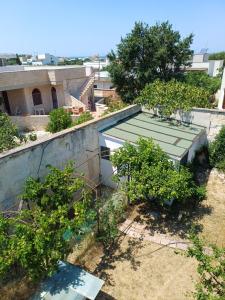 an overhead view of a garden with trees and a building at Villa Alma in Bari
