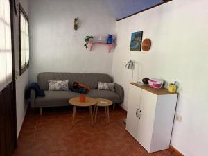 a living room with a couch and a table at Finca Nim 2 in Mogán
