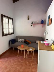a living room with a couch and a table at Finca Nim 2 in Mogán +18 photos