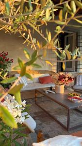 a living room with a couch and a table at Riant Relais de Charme in Greve in Chianti +45 photos