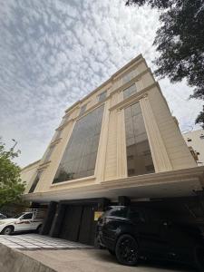 a building with a car parked in front of it at أوريانا oRIANA in Jeddah