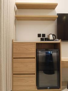 a kitchen with a counter with a stove top oven at Tim in Riyadh