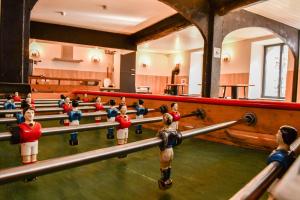 a group of wooden dolls in a gym at Villa du Parc le Lilas in Formiguères