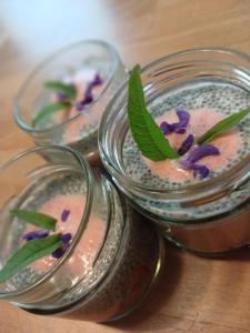 two mason jars filled with soy sauce and purple flowers at Bergbauernhof Stauder - Hirschbergalpakas in Lendorf