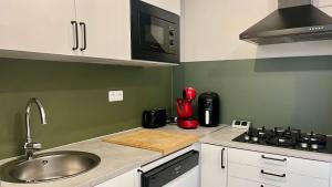 a kitchen with a sink and a counter top at Un,Deux,Trois...Soleil in Le Pradet