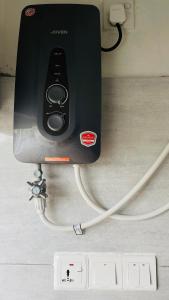 a speaker hooked up to a wall with cables at Judewin villa Negombo in Negombo
