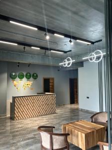 a lobby with a table and chairs in a room at Royal Forest Dilijan in Dilijan