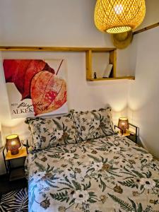 a bedroom with a bed and two lamps at Tiny home in Camigliatello Silano