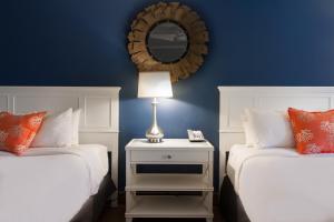 a bedroom with a bed and a lamp at Banana Bay Resort & Marina in Marathon