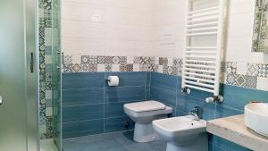 a bathroom with a toilet and a sink at Medoro Camere Milazzo in Milazzo +44 photos