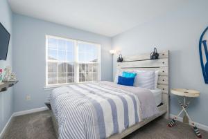 a bedroom with a large bed and a window at Spacious Resort Villa Near Beach - VBBL in Ocean View