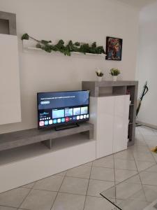 a tv on a wall in a living room at Casa Vacanze Daniele in Pontecagnano