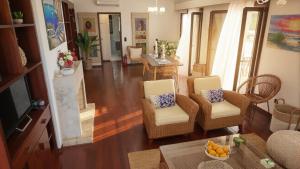 a living room with two chairs and a table at Moustakias Villa in Kefallonia