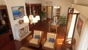 an aerial view of a living room with chairs and a fireplace at Moustakias Villa in Kefallonia