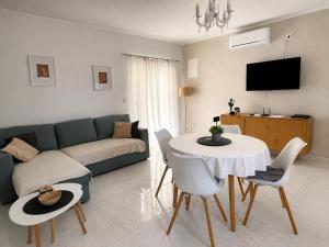 a living room with a couch and a table at Apartmani Stellar in Malinska
