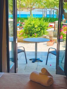 a room with a table with a towel on a table at Aetherion in Agios Ioannis Pelio