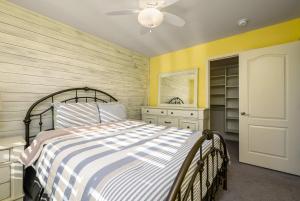 a bedroom with a bed and a dresser and a closet at Villa at Greys Neck - Close to Bethany Beach in Millville