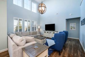 a living room with a couch and a tv at Villa at Greys Neck - Close to Bethany Beach in Millville +38 photos