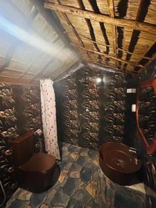 a bathroom with a toilet and a sink at AAA Happy Hostel in Arugam Bay +30 photos