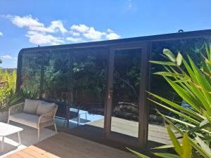 a glass house with a view at FALCOARIA Eco in Setúbal +9 photos